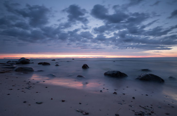 Fototapeta na wymiar Sunset from the beach of a national park in sweden photographed with long exposure