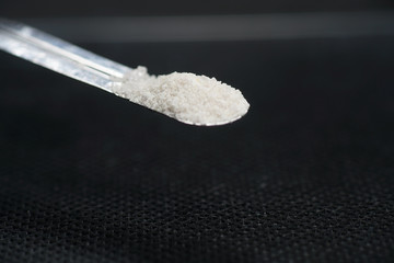 Chemical powder from the chemistry kit with macro lens photographed in studio
