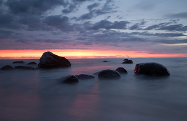 Fototapeta na wymiar Sunset from the beach of a national park in sweden photographed with long exposure