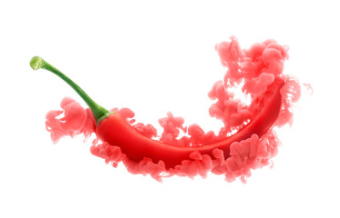 Red chili pepper on ink isolated over white background