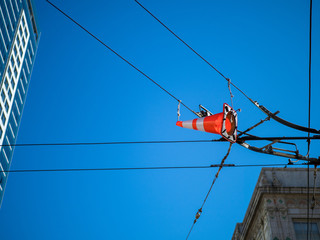 Hanging safety cone on bus lines
