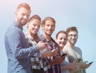 group of young people with modern smartphones.