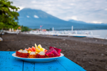 Fruit breakfast by the sea with a view of the Agung volcano. Bali