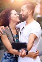 Happy traveling couple making selfie, romantic mood.