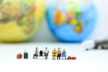 Miniature people : traveler  with world map, backpack and travel concept.