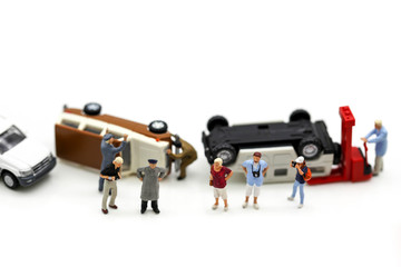 Miniature people : people with toys car crash accident damaged.