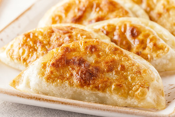 Plate of asian gyoza, dumplings snack.