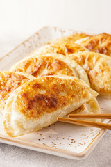 Plate of asian gyoza, dumplings snack.