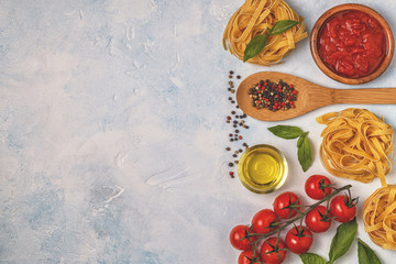 Italian food background with pasta, spices and vegetables.