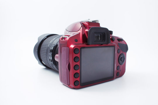 Red Camera With A Lens On A White Background