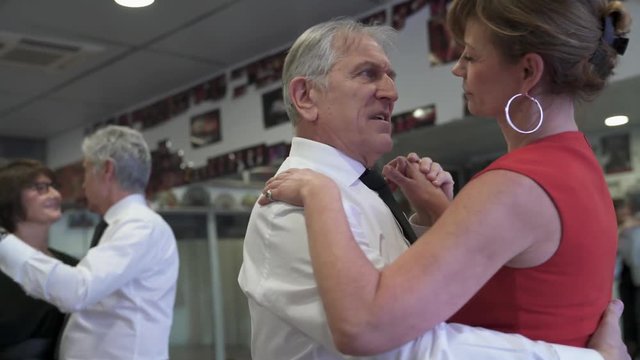 Senior couple attending dance class