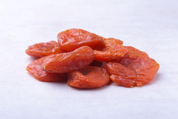 dried apricots isolated white background. selective focus.