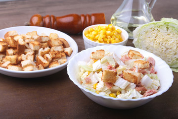 Fresh Chinese cabbage, Sweet canned corn, Delicious crispy croutons and canned tuna. Ingredients for dietary salad.