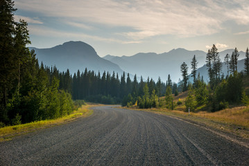 Gravel road in Kananaskis Country, Alberta with haze from forest fires in the air