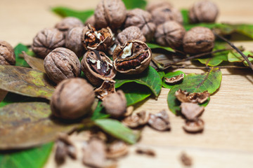 Several walnuts lie on brown background