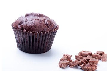 Delicious homemade cupcake with raisins and chocolate isolated on white background. Muffins. Top view.