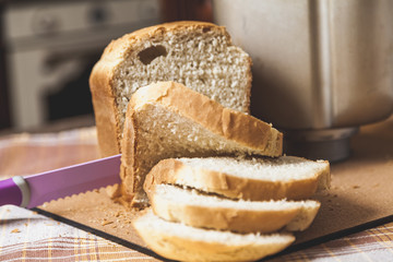 large knife sliced fresh bread slices