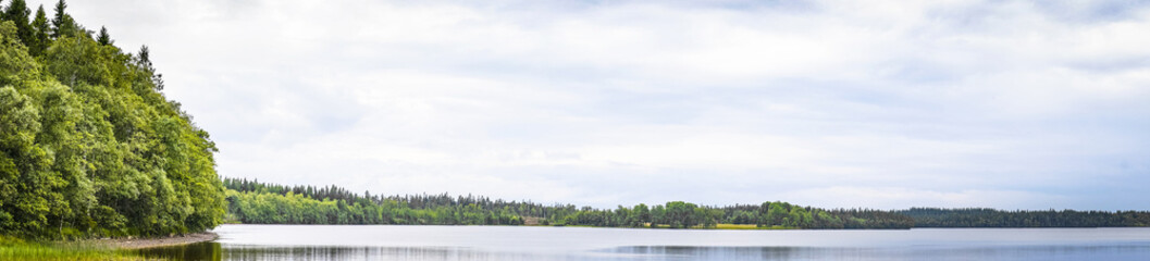Lake scenery in panorama with calm water