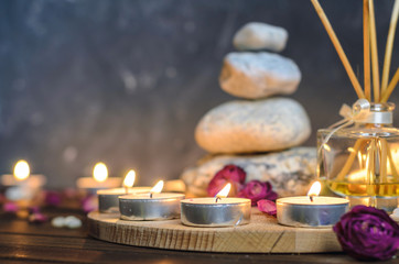 Fototapeta na wymiar Spa composition-stones, candles, aromatherapy, dry flowers.