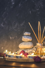 Spa composition-stones, candles, aromatherapy, dry flowers.