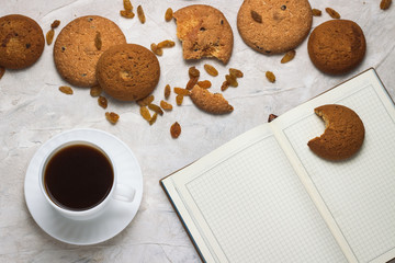 Cup with Black Coffee, Cookies, Diary on the Light Background