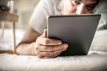 Holding digital tablet.