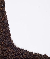 Coffee beans on a white background under the text