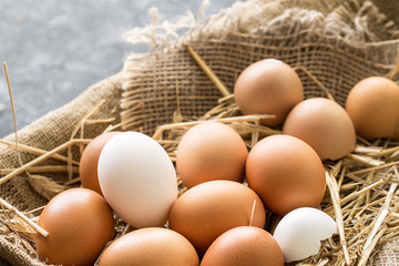 bunch of fresh brown eggs  in a wooden crate