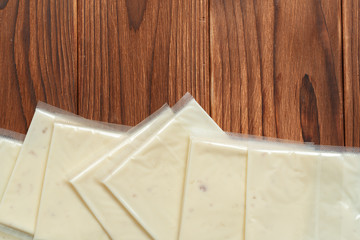 Naklejka na ściany i meble Cheese on wooden table