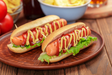 Hot dogs on wooden background