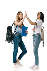 Fototapeta premium multicultural students giving high five isolated on white