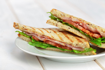 Club sandwich on wooden table