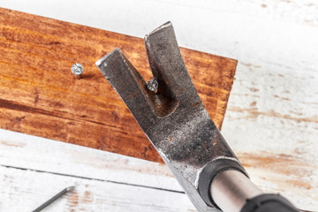 Hammer and nails on wood background