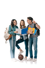 Fototapeta premium multicultural students looking at book and man showing idea sign on white