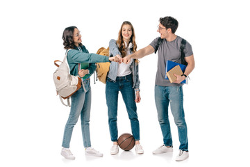 Fototapeta premium happy multicultural students making fist bump on white