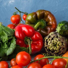 Assortment of fresh italian vegetables on wooden table