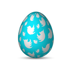 Blue Easter egg with white birds and light shadow