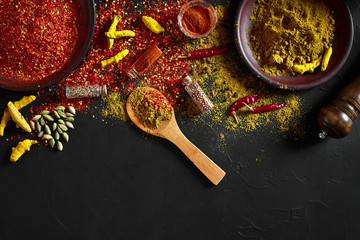 Exotically Spice Mix - spice, herbs, powder top view over dark background. Cooking and spicy food concept. Copy space
