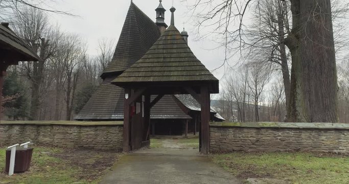 Aerial shot of the crossing the gate to old church in Europe, winter 4k