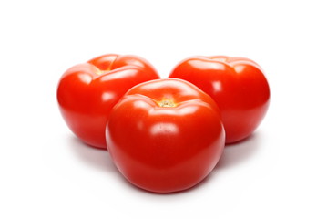 Fresh ripe, red tomatoes isolated on white background