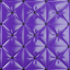 Stitched upholstery leather violet background with buttons