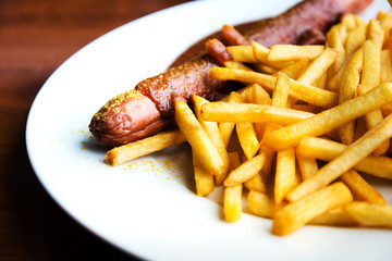 Grilled sausage served with french fries