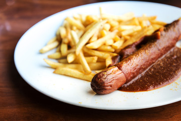 Grilled sausage served with french fries