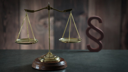 Law theme, mallet of the judge, wooden desk,