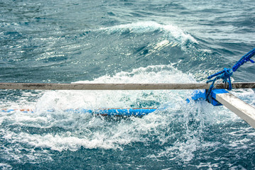 Bangka boat sailing through El Nido bay, Philippines