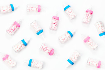Decorative Baby milk bottles with candy. Decoration for Baby shower party. Flat lay, top view