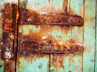 Old wood background texture. Vintage warehouse door and metal element. Rural architecture.