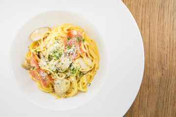 Spaghetti Carbonara.This recipe with Bacon Egg Mushroom Parmesan cheese and Spaghetti.Food styling on table.