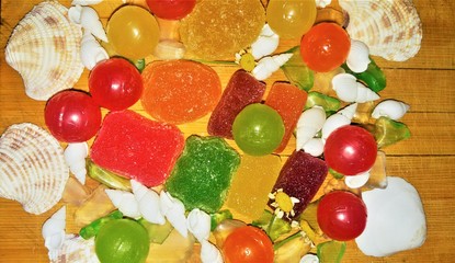 Colored marmalade with candies and sea shells