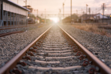 Fototapeta na wymiar Railroad tracks. with sun rays background.